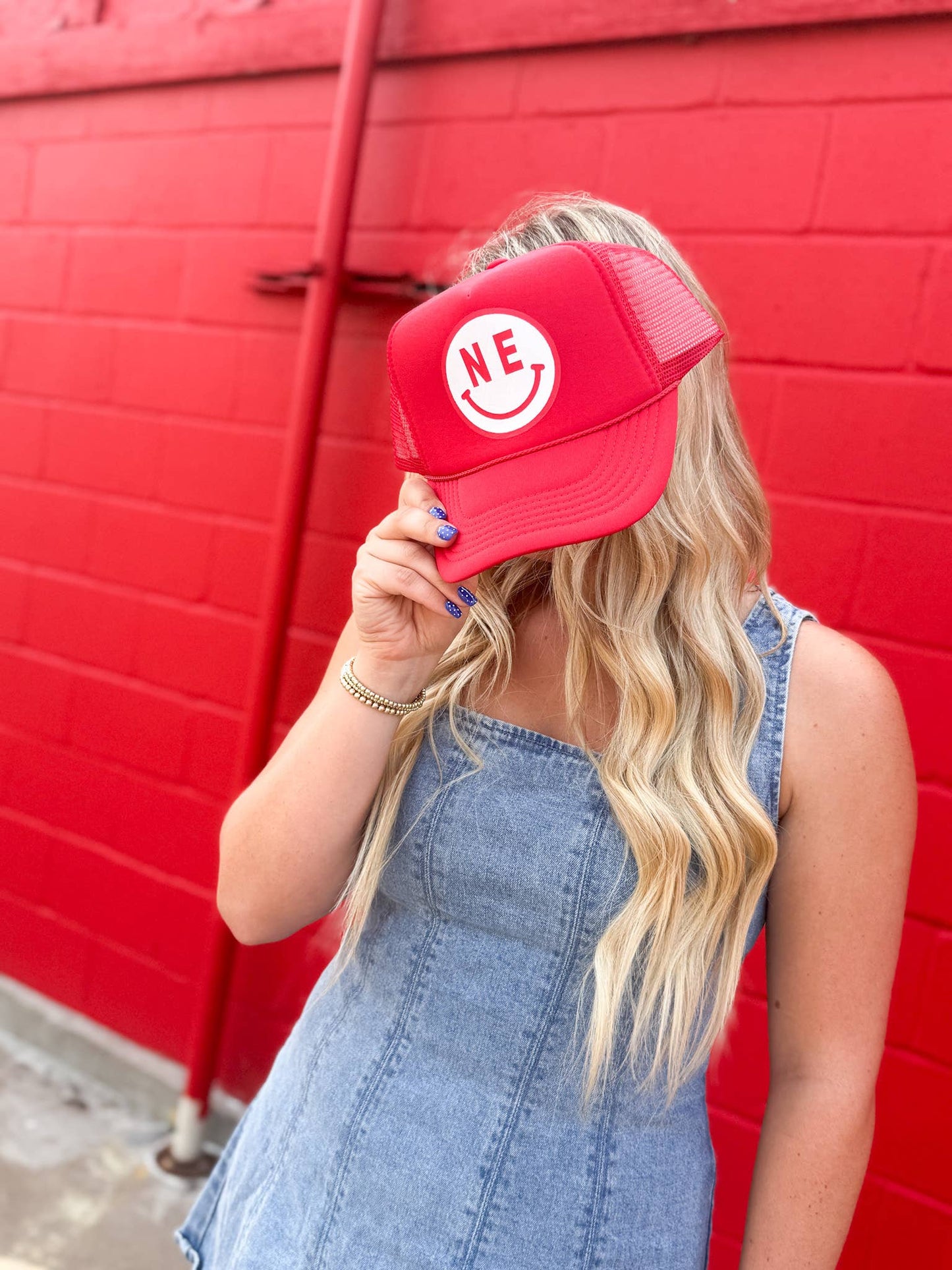 Red NE Smiley Trucker Hat