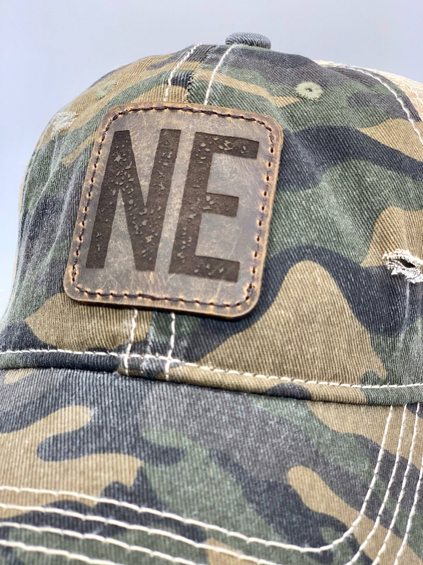 Camo Leather Patch Ponytail Hat with State Abbreviation: Olive Camo / Nebraska