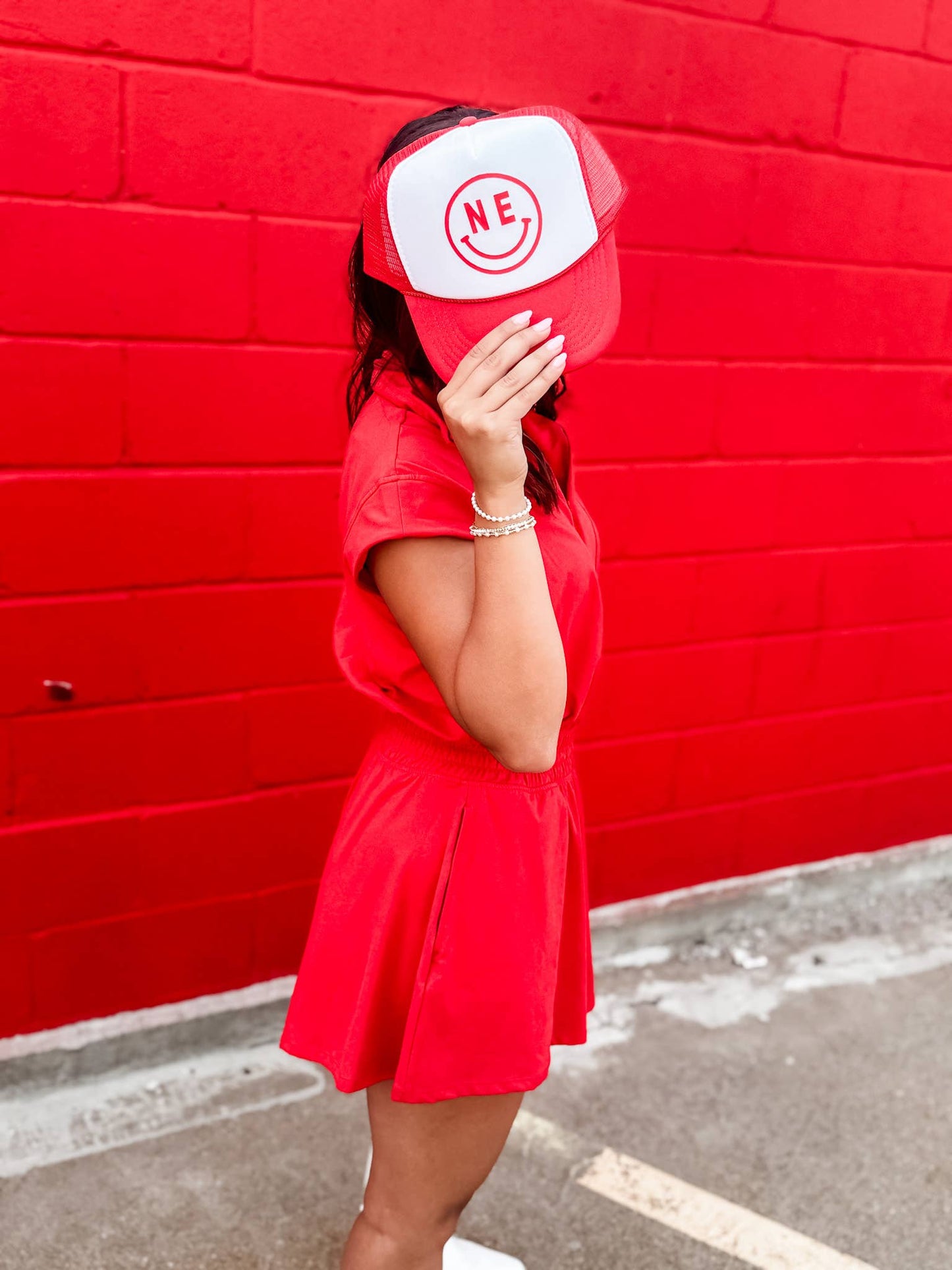 Red & White NE Smiley Trucker Hat